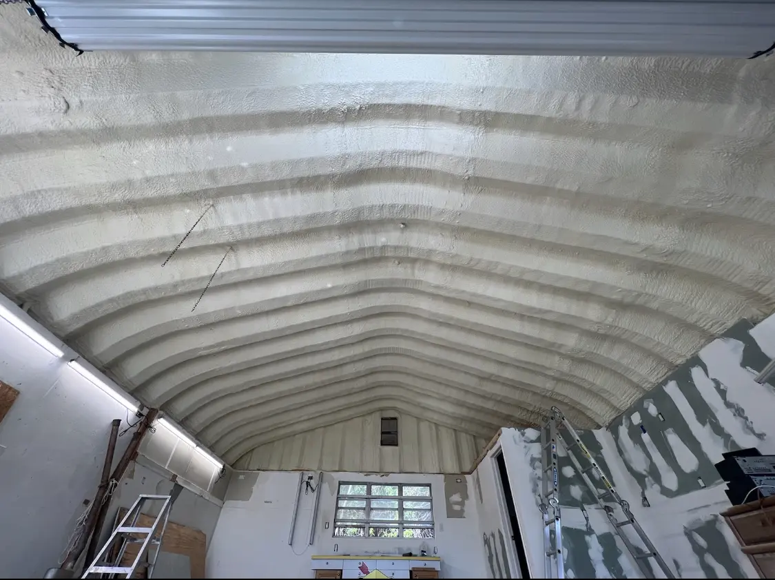Spray polyurethane foam applied to the underside of a metal roof deck in Nyack